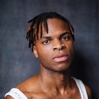 Headshot of Keanu Adolphus Johnson looking directly at the camera.