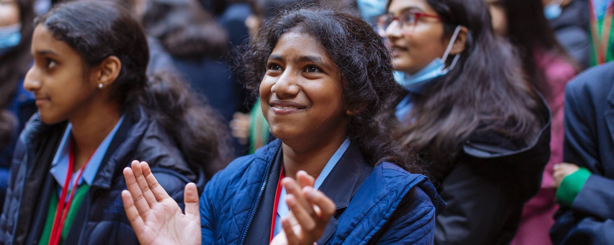 Audience members watching a production of Playing Shakespeare with Deutsche Bank: A Midsummer Night's Dream at the Glboe Theatre in 2021.
