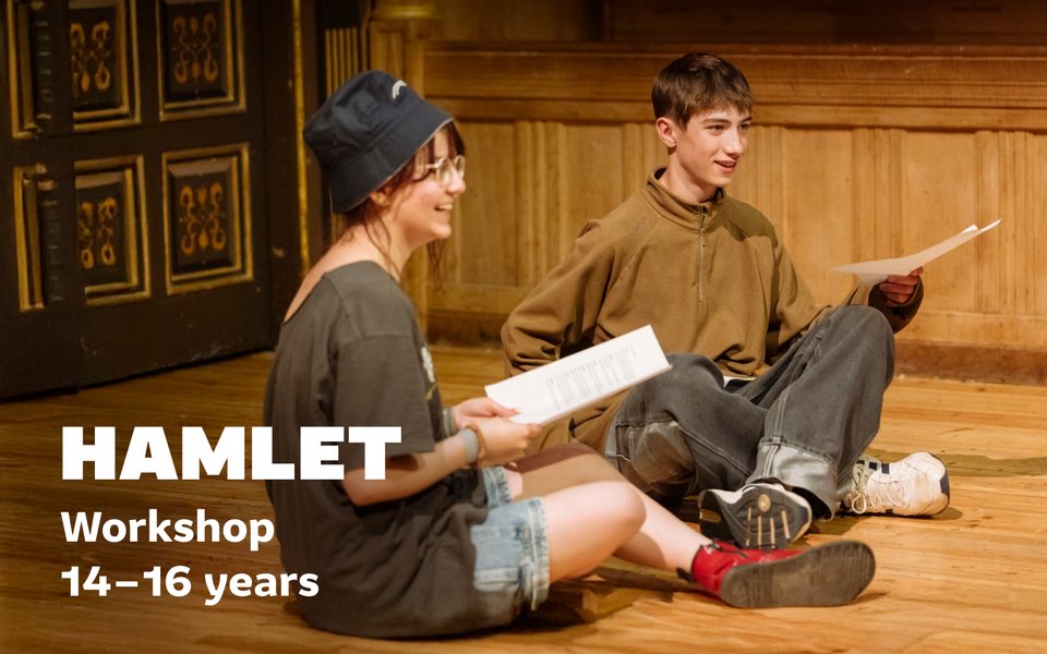Two young people sat cross-legged on the Sam Wanamaker Playhouse stage with scripts. White text reads "Hamlet workshop 14-16 years"