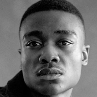 An actor looking into the camera.